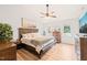 Comfortable main bedroom with vaulted ceilings, wood floors, and a stylish dresser at 3401 Sitzman Ct, Raleigh, NC 27616