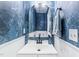 Stylish powder room with blue floral wallpaper and modern fixtures at 3401 Sitzman Ct, Raleigh, NC 27616