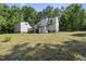 Spacious backyard with a deck, balcony, and separate garage at 3504 Lexham Ct, Apex, NC 27539