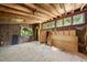 Unfinished basement featuring a window, wooden floor, unfinished walls, exposed beams and insulation at 3504 Lexham Ct, Apex, NC 27539
