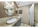 Bathroom featuring dual sinks, granite countertop, updated mirrors, and tile floors and shower at 3504 Lexham Ct, Apex, NC 27539