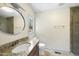 Bright bathroom with single vanity, granite countertop, round mirror, modern fixtures, and tile flooring at 3504 Lexham Ct, Apex, NC 27539