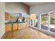 Open-concept kitchen featuring an island and hardwood floors at 3504 Lexham Ct, Apex, NC 27539