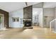 Bright living room featuring a stone fireplace and hardwood floors at 3504 Lexham Ct, Apex, NC 27539