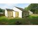 Backyard featuring an outdoor fire pit with mature trees and spacious yard, perfect for outdoor activities at 3709 Fan Palm Ct, Raleigh, NC 27616