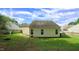 Spacious backyard offering ample green space and a view of the surrounding neighborhood at 3709 Fan Palm Ct, Raleigh, NC 27616