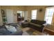 Spacious living room features an open floor plan with a view of the dining area and natural light at 3709 Fan Palm Ct, Raleigh, NC 27616