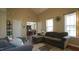 Spacious living room features an open floor plan with a view of the dining area and natural light at 3709 Fan Palm Ct, Raleigh, NC 27616