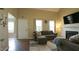 Comfortable living room features a fireplace, neutral decor, ample natural light and an exterior door at 3709 Fan Palm Ct, Raleigh, NC 27616