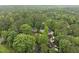 Bird's-eye view of neighborhood homes shaded by mature trees at 4 Weathergreen Ct, Durham, NC 27713