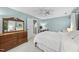 Charming bedroom showcases a dresser, and a comfortable bed with a white duvet at 4 Weathergreen Ct, Durham, NC 27713