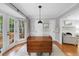 Dining area featuring hardwood floors, a drop leaf table, and plenty of natural light at 4 Weathergreen Ct, Durham, NC 27713