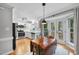 Cozy kitchen with white cabinets, stainless steel appliances, and a breakfast table at 4 Weathergreen Ct, Durham, NC 27713