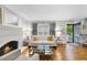 Bright living room featuring hardwood floors, a fireplace, and neutral decor at 4 Weathergreen Ct, Durham, NC 27713