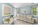 Comfortable sitting area features a plush sofa, chair, and natural light at 4 Weathergreen Ct, Durham, NC 27713