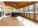 Covered back porch with a hot tub and a view of the backyard at 405 Challenge Rd, Raleigh, NC 27603