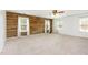 Bright and spacious bedroom with a hardwood accent wall and plenty of natural light at 405 Challenge Rd, Raleigh, NC 27603