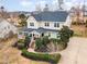 Beautiful two-story home featuring manicured landscaping, a welcoming porch, and a spacious driveway at 405 Challenge Rd, Raleigh, NC 27603