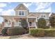Charming two-story home with a large front porch and well-manicured landscaping at 405 Challenge Rd, Raleigh, NC 27603