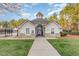 Community Pool house with stone accents, white siding, and inviting entrance at 405 Challenge Rd, Raleigh, NC 27603