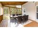 Screened-in porch with an outdoor dining area at 405 Challenge Rd, Raleigh, NC 27603