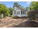 Charming backyard brick patio with a white two-story house at 406 E Lee St, Smithfield, NC 27577