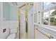Bathroom showcases a tiled shower with gold trim and an updated toilet at 406 E Lee St, Smithfield, NC 27577