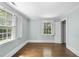 Bright bedroom features hardwood floors, multiple windows, and natural light at 406 E Lee St, Smithfield, NC 27577