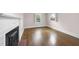 This bedroom features a fireplace and natural light from two windows at 406 E Lee St, Smithfield, NC 27577