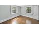 Bright bedroom features hardwood floors, multiple windows, and natural light at 406 E Lee St, Smithfield, NC 27577
