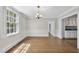 Elegant dining room with hardwood floors, large windows, chandelier, and classic trim at 406 E Lee St, Smithfield, NC 27577