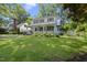Charming home with inviting front porch, swing, and lush green lawn offering timeless appeal at 406 E Lee St, Smithfield, NC 27577