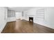Bright living room with fireplace, built-in shelving, and hardwood floors at 406 E Lee St, Smithfield, NC 27577