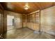 Wood paneled room with built in shelving, hardwood floors, and natural light at 406 E Lee St, Smithfield, NC 27577