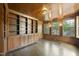 Wood paneled room with built in shelving, hardwood floors, and natural light at 406 E Lee St, Smithfield, NC 27577