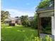 Expansive backyard with mature trees and screened porch, offering privacy and outdoor enjoyment at 411 W Killiegrey St, Lillington, NC 27546