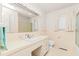 Bright bathroom with a large mirror and built-in vanity at 411 W Killiegrey St, Lillington, NC 27546