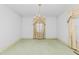 Spacious dining room with elegant chandelier and large window at 411 W Killiegrey St, Lillington, NC 27546