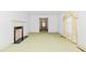 Bright living room with a fireplace and a doorway to the dining room at 411 W Killiegrey St, Lillington, NC 27546