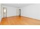 Spacious main bedroom with hardwood floors and en suite bathroom at 411 W Killiegrey St, Lillington, NC 27546