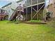 Expansive backyard featuring elevated decks with stairs, perfect for outdoor entertaining at 4125 Enfield Ridge Dr, Cary, NC 27519