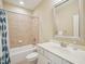 Well-lit bathroom with vanity, sink, bathtub, and shower at 4125 Enfield Ridge Dr, Cary, NC 27519