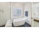 Bathroom featuring a luxurious soaking tub and glass enclosed shower at 4125 Enfield Ridge Dr, Cary, NC 27519