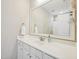 Bathroom featuring a large mirror, white cabinets, and a sink with countertop space at 4125 Enfield Ridge Dr, Cary, NC 27519