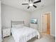 Cozy bedroom with neutral walls, ceiling fan, and comfortable bed with white bedding at 4125 Enfield Ridge Dr, Cary, NC 27519