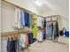 Spacious walk-in closet with ample storage and organized clothing racks at 4125 Enfield Ridge Dr, Cary, NC 27519