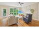 Inviting living room features a fireplace, hardwood floors, and a door to deck at 4125 Enfield Ridge Dr, Cary, NC 27519