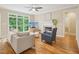 Cozy living room with fireplace, hardwood floors, and natural light at 4125 Enfield Ridge Dr, Cary, NC 27519