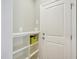 Mudroom features a white door and a shelving unit with storage compartments at 4125 Enfield Ridge Dr, Cary, NC 27519