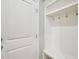Mudroom features a white door and a shelving unit with hooks at 4125 Enfield Ridge Dr, Cary, NC 27519